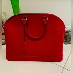 Luis Vuitton 100% leather bag with suede lining. Limited edition